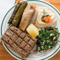 Combo For 1 · Three cabbage three Grape Leaves small piece of kibbie, scoop of hummus and Tabouli. Pita in...