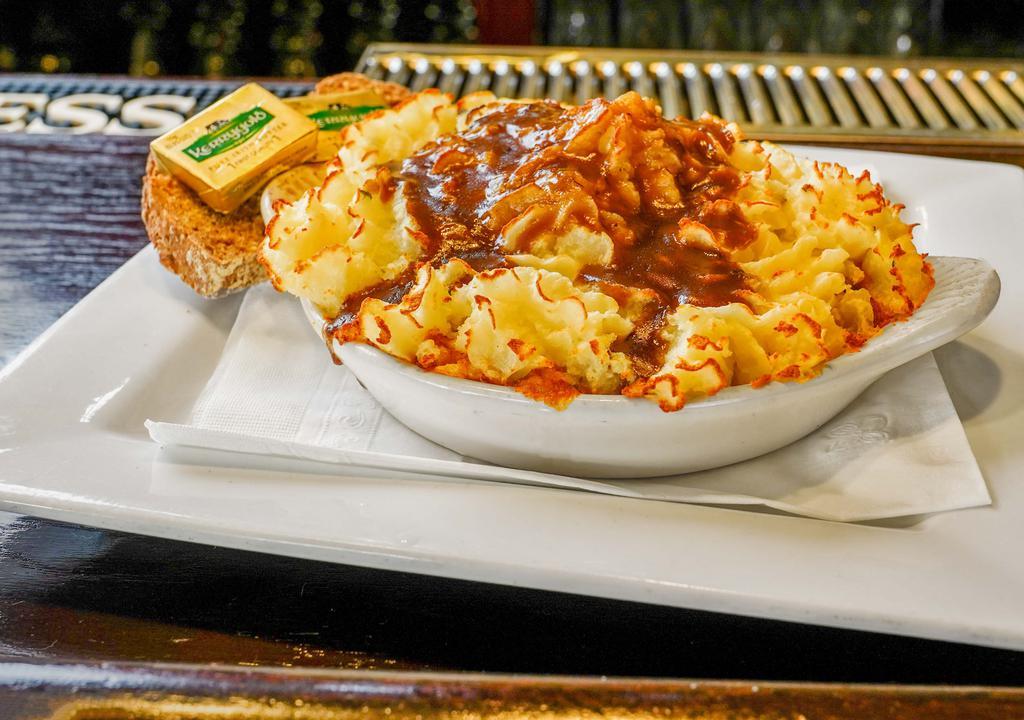 Shepherd’S Pie · Ground beef sautéed with carrots, peas, corn, onions, herbs, and Irish brown gravy topped with creamed Irish potatoes and served with fresh bread.