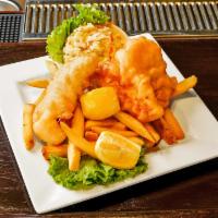 Dublin Fish & Chips · Fresh cod fillet ale battered and fried until golden brown and served with pub fries, colesl...