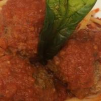 Linguini Pomodoro With Meatballs · Our house-made tomato and basil marinara tossed with linguini served with three wood-roasted...