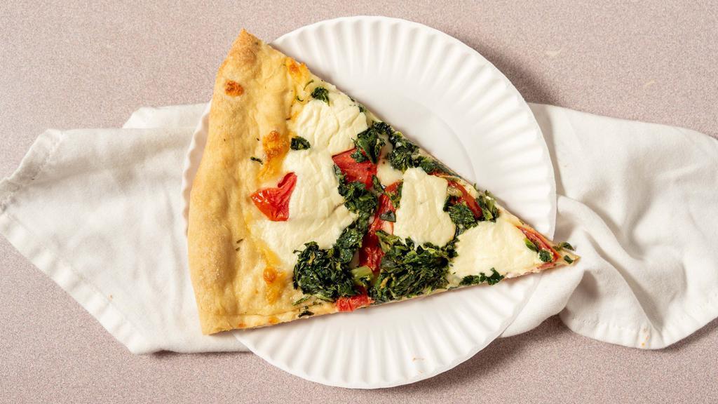 White Veggie Spinach Pizza · Mozzarella and ricotta cheese, marinated tomatoes slice, spinach and garlic, and oil.