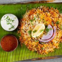 Hyderabadi Vegetable Dum Biryani · Delicious Vegetable dhum Biriyani (layered) made of Basumati rice. Served with Raita (yogurt...
