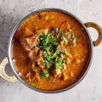 Mutton Curry · Virundhu special mutton curry. Served with a bowl of rice.