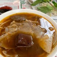Hoanh Thanh Soup · Wonton soup. Lean pork and shrimp dumpling gently boiled in clear chicken broth with lettuce...