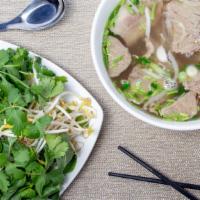 Pho Ga · Chicken noodle soup with shredded chicken in an aromatic chicken broth. With scallion, cilan...