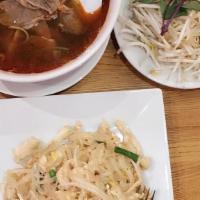 Bun Bo Hue · Spicy. Rice vermicelli noodle in an aromatic lemongrass beef broth with flank steak. With sc...