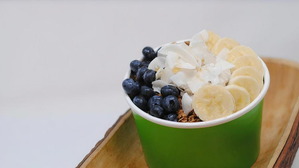 Classic Bowl · Choice of smoothie bowl base topped with Purely Elizabeth Gluten Free Granola, fresh banana, blueberry, coconut flakes and an organic maple drizzle! ALLERGENS: COCONUT (classic bowl) , ALMOND (acai), COCONUT (coconut), COCONUT (green)