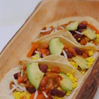 Breakfast Tacos · Corn tortillas topped with our famous veggie chili, tofu scramble, avocado and cheez! GLUTEN...