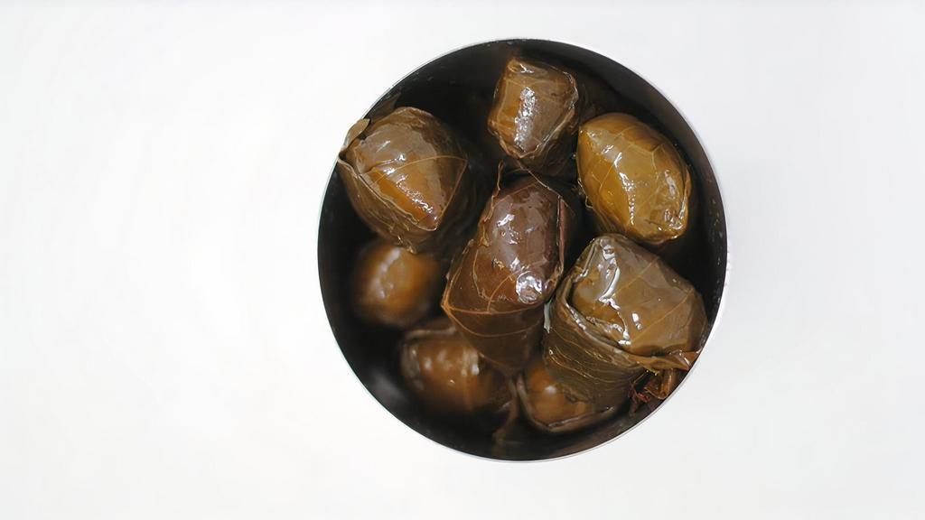 Grape Leaves (6Pc) · Aromatic rice and herbs wrapped in grape leaves and marinated in light olive oil and lemon. 6 pieces
