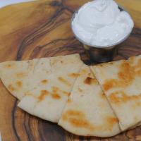 Tzatziki (8Oz) · Our famous, house-made vegan tzatziki! Served with choice of carrots or grilled pita bread. ...
