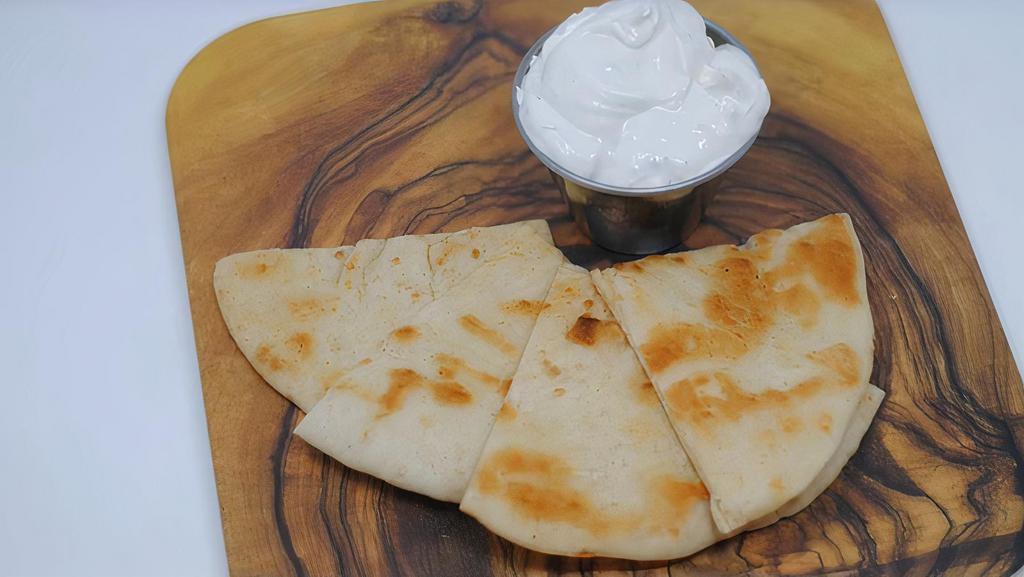 Tzatziki (8Oz) · Our famous, house-made vegan tzatziki! Served with choice of carrots or grilled pita bread. 8oz. ALLERGENS: SOY, WHEAT (for pita only)