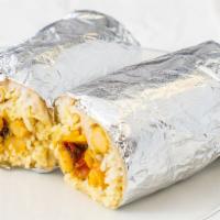 Chana Masala Burrito  · Chickpeas cooked in a blend of spices, rice, sautéed cabbage, cucumber raita, crunchy bits, ...