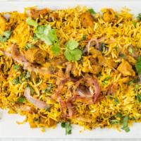 Goat Biriyani  · Goat cubes cooked with biriyani masala, spices and basmati rice topped with fried onions and...