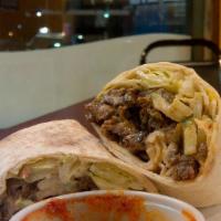 Lamb Shawarma Rollup · Authentic rotisserie (mixed lamb & beef) thinly sliced served on pita bread w/garlic paste a...