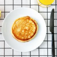 Labc Pancakes · Two fluffy pancakes served with a side of butter and syrup. Morning sunshine.