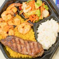 Steak And Shrimp Signature Platter · Served over rice with pita bread and two sides.