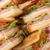 Ham And Cheese Club Sandwich · Includes French fries.