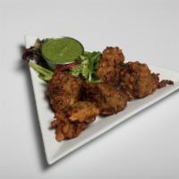 Vegetable Pakoras · Cut vegetable fritters deep fried in chickpea batter. Served with homemade chutneys.