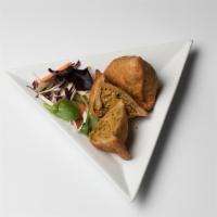 Chicken Samosas · Deep fried light spicy turnovers stuffed with minced chicken and green peas. Served with  ho...