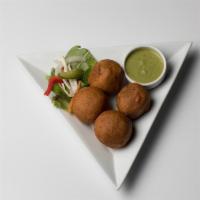 Aloo Bonda · Spicy, garlicky potato fritters with black mustard seeds. Served with homemade chutneys.
