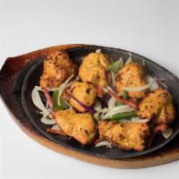 Chicken Tikka · Boneless chicken breast cubed and marinated in yogurt and an array of spices, cooked in our ...