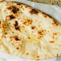 Plain Naan · Unleavened white flour bread baked in our Tandoor, with clarified butter on it.