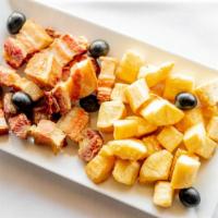Mandioca Com Torresmo · Fried crispy pork (slab bacon) paired with diced cassava (yuca)