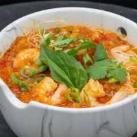 Thai Shrimp Curry Noodle · Shrimp, Red Curry Coconut Milk Broth, Rice Noodles, Thai Basil, Cilantro, Lime