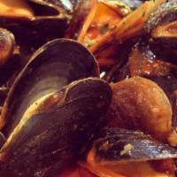 Mussels · In white wine and tomato sauce.