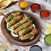 Chicken Seekh Kabab · Minced chicken seasoned with ginger, garlic, herbs, spices and cooked in tandoor oven.