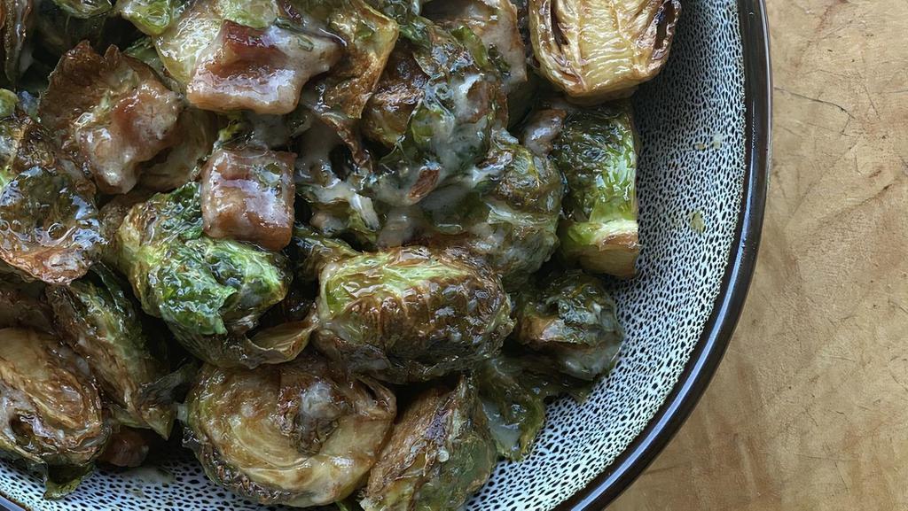 Crispy Brussels Sprouts · Tossed with a Bacon Vinaigrette