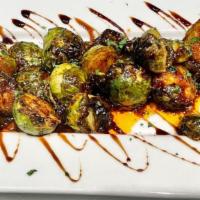 Roasted Brussels Sprouts · Organic Brussels  roasted with our house made secret vegan sauce.