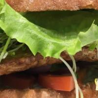 Hula Burger · Organic marinated tempeh with mango salsa, sprouts, lettuce, tomato, onion, bells, cucs, veg...