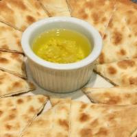 Pita Side · Warm pita with garlic olive oil.