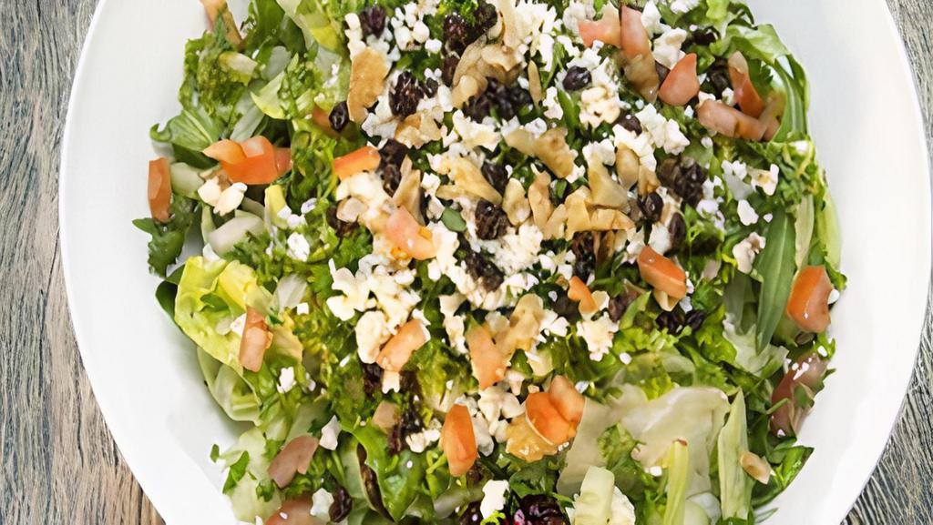 Mediterranean Salad · Mixed greens and iceberg lettuce, tomatoes, onions, raisins, chopped parsley, walnuts and crumbled feta cheese