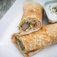 Moby'S Kubideh Kabob Sandwich · Ground beef, grated onion with house seasoning. Wrapped in a house pita bread with lettuce, ...