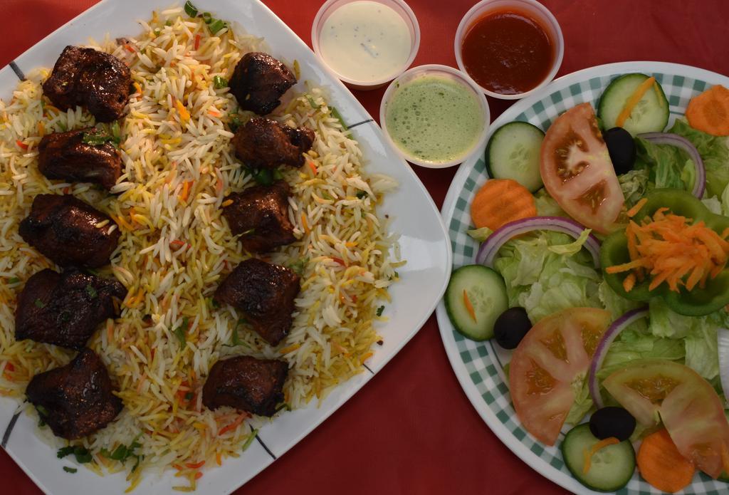 Beef Tikka Platter · Beef Cubes Barbecue to Perfection in Tandoor (Clay Oven).  2 Skewers Beef Tikka with Rice and Salad