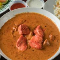 Chicken Tikka Masala · Tomato Rich Creamy Curry with Chicken cutlets inside serve with Rice or Naan
