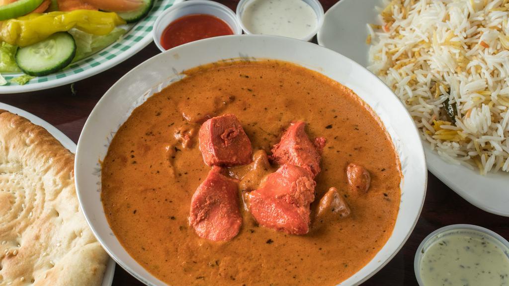 Chicken Tikka Masala · Tomato Rich Creamy Curry with Chicken cutlets inside serve with Rice or Naan