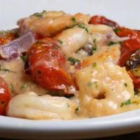 Shrimp Scampi · Gulf shrimp, roasted tomatoes, white wine sauce, angel hair pasta.