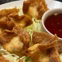 Crab Wontons · Surimi, cream cheese, green onions and garlic peppered spices wrapped in wonton skin. Deep-f...