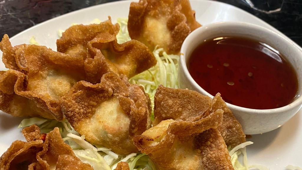 Crab Wontons · Surimi, cream cheese, green onions and garlic peppered spices wrapped in wonton skin. Deep-fried to crisp. Served with sweet chili sauce.