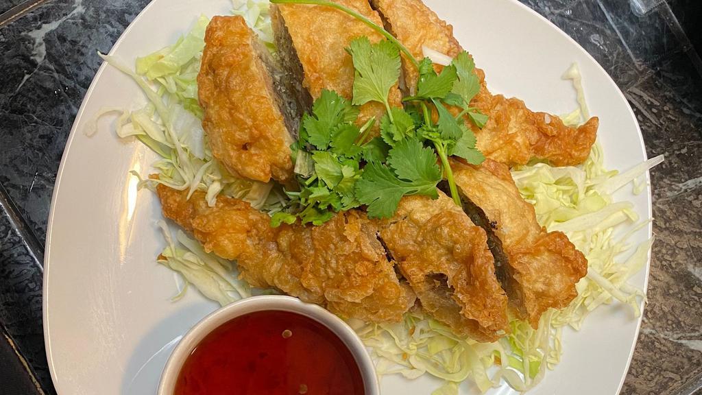 Angel Wings · De-boned chicken wings, stuffed with minced pork, spice, bean thread noodles and cabbage. Battered and deep-fried, served with sweet chili sauce.