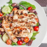 Grilled Chicken Salad · Our garden salad topped with fresh marinated grilled chicken. Served with our garlic bread s...