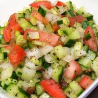 #9. Salad Shirazi · Chopped cucumber and tomato, onion, lemon juice, olive oil and spices.