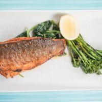 Grilled Branzino (Dinner) · House spice, tempered spinach and broccolini.