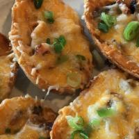 Stuffed Potato Skins · Potatoes with melted Vermont cheddar & smoked bacon, sour cream.
