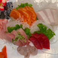 Sashimi Deluxe (18 Pc) · Assorted fillets of sliced raw fish.