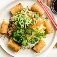 Egg Roll Over Vermicelli · Rice noodle topped with egg rolls, cucumber and crushed peanuts.