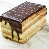 Boston Cream Pie Slice · layers of coffee soaked vanilla sponge cake with vanilla pastry cream all covered in chocola...